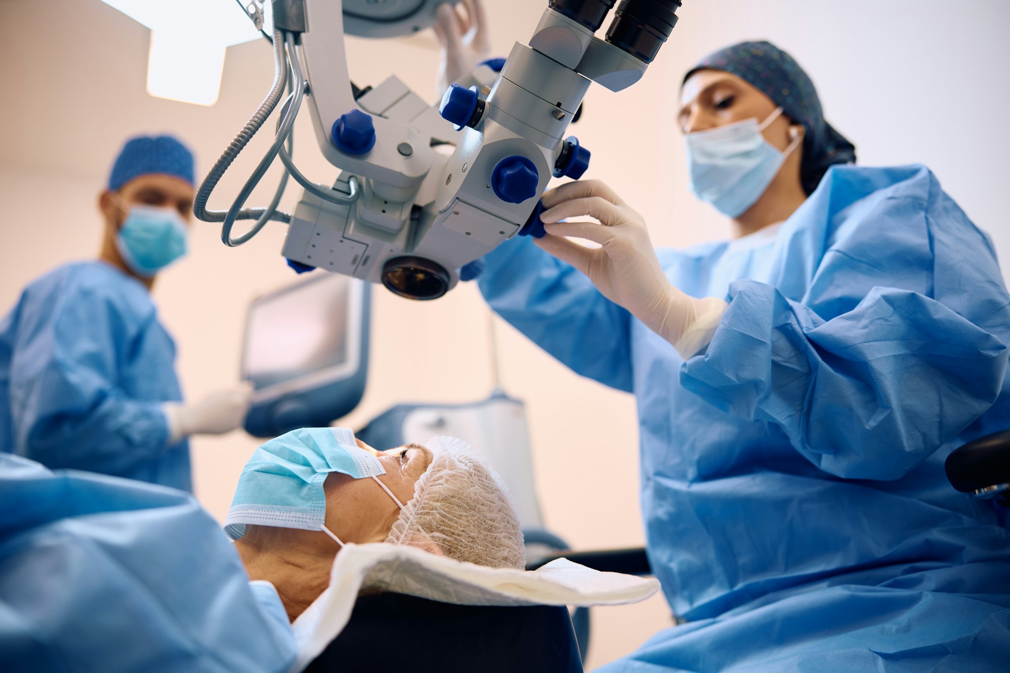 Mature woman having eye surgery at ophthalmology clinic.